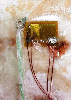 Figure 2 A close up of the strain gauges and thermocouple prior to covering with rubber insulation.